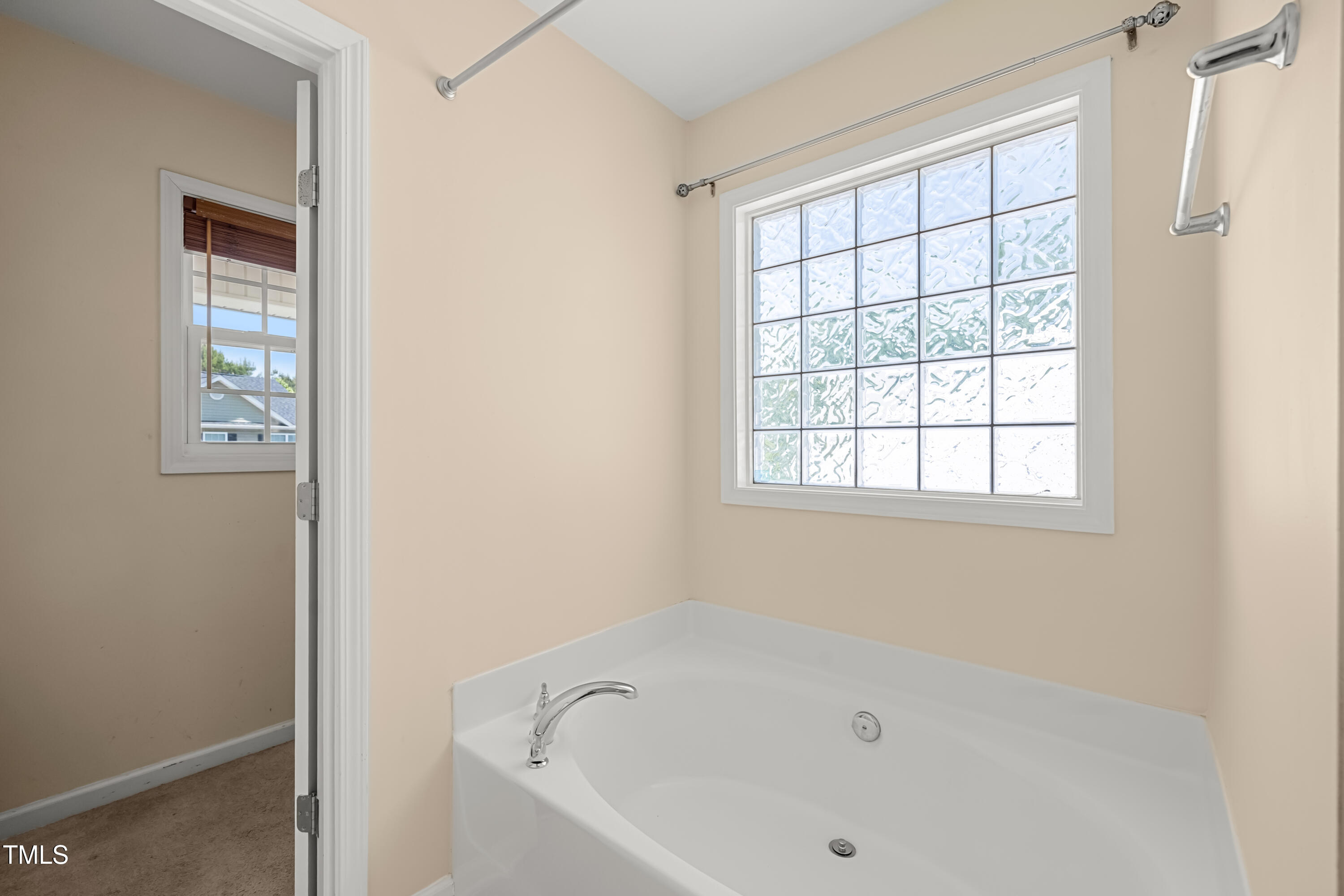 5865 Forest Point Road Raleigh, NC 27610 - Photo 24 of 37 a white bath tub sitting next to a window