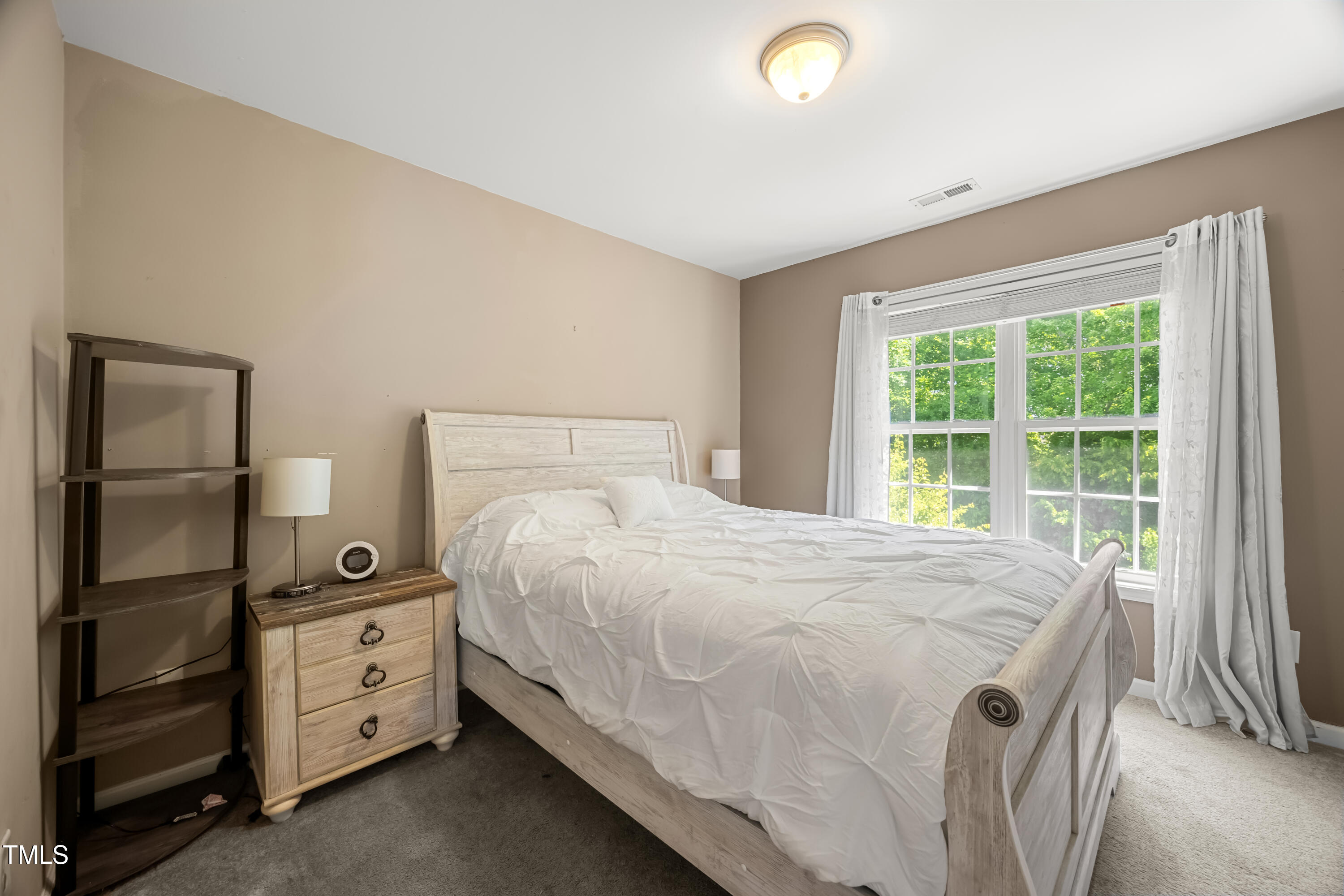 5865 Forest Point Road Raleigh, NC 27610 - Photo 26 of 37 a bedroom with a bed and a window