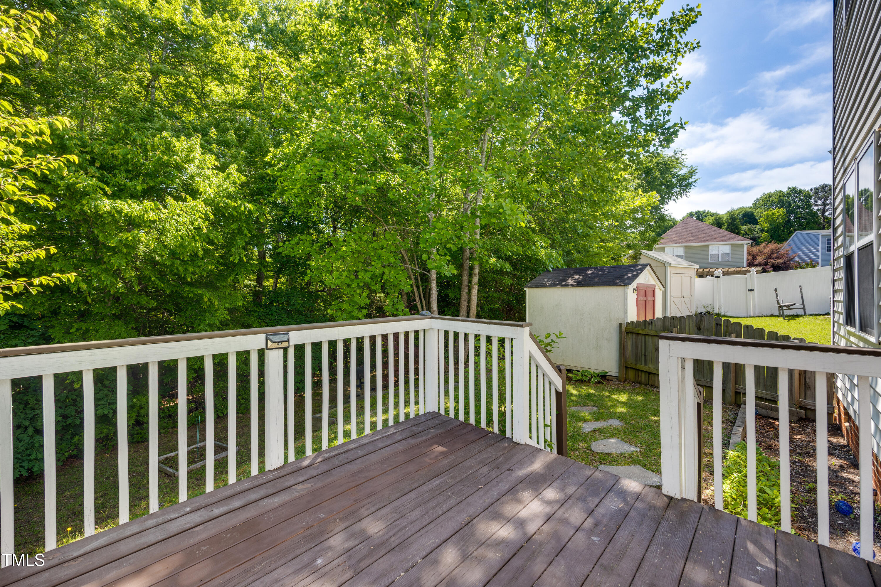5865 Forest Point Road Raleigh, NC 27610 - Photo 30 of 37 a view of deck with wooden floor and fence