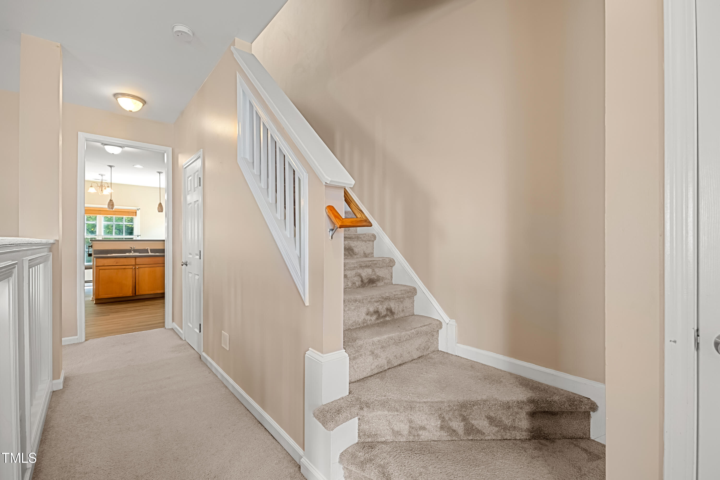 5865 Forest Point Road Raleigh, NC 27610 - Photo 6 of 37 a view of a hallway with staircase