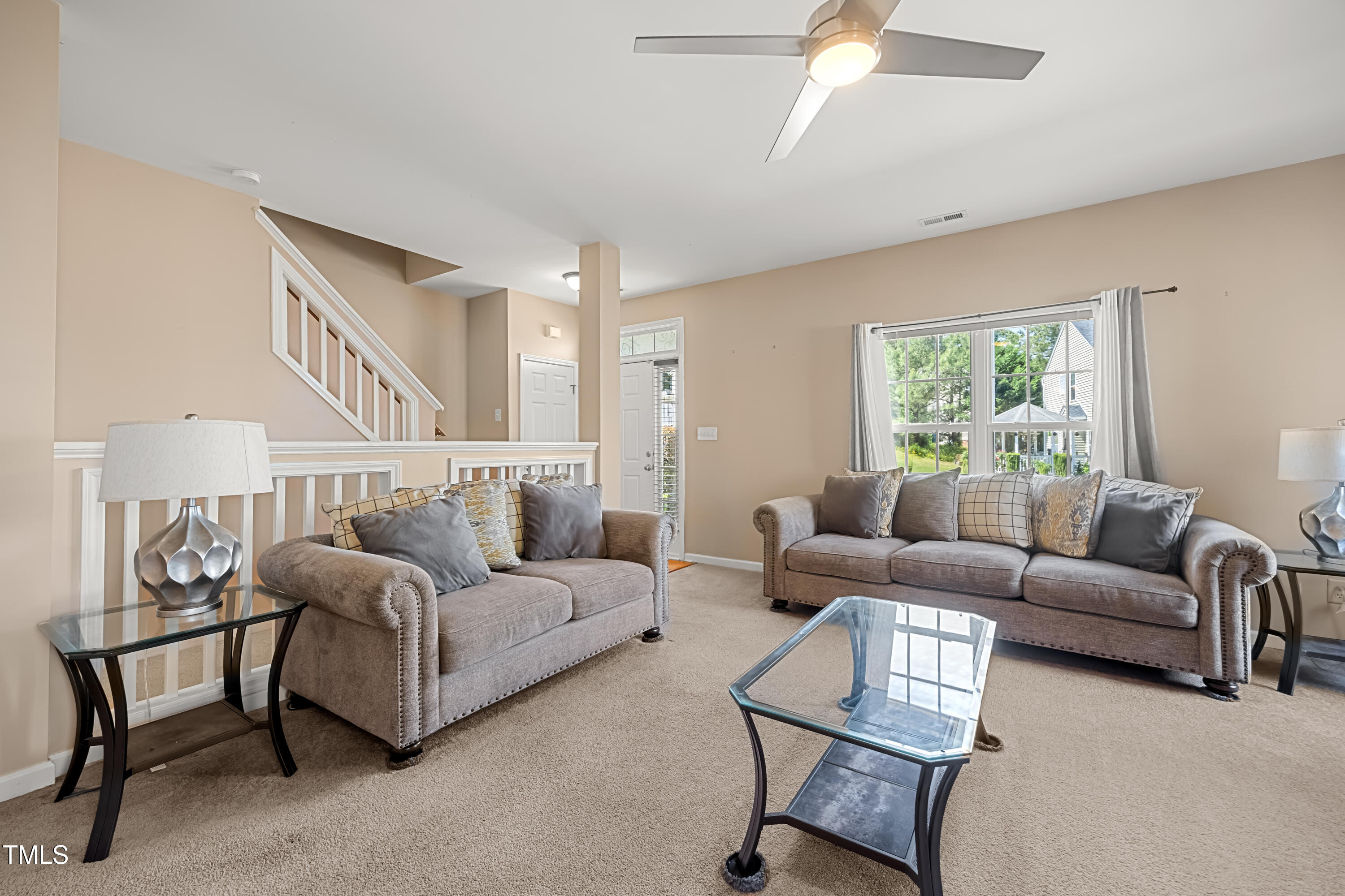 5865 Forest Point Road Raleigh, NC 27610 - Photo 7 of 37 a living room with furniture and a large window