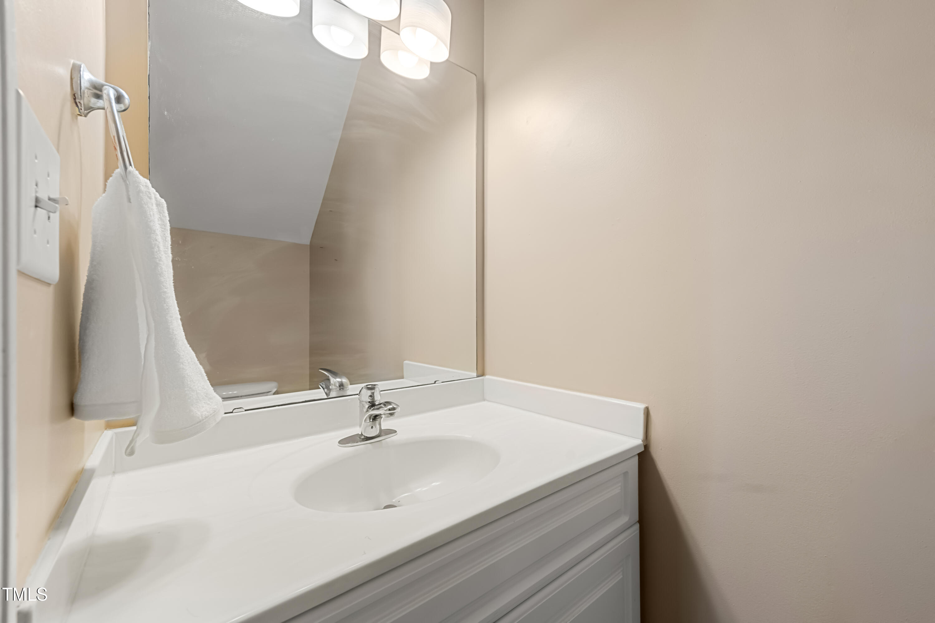 5865 Forest Point Road Raleigh, NC 27610 - Photo 9 of 37 a bathroom with a sink and a mirror