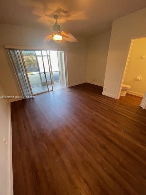 4938 Palmbrooke Circle West Palm Beach, FL 33417 - Photo 12 of 32 an empty room with wooden floor and windows