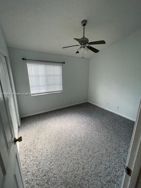 4938 Palmbrooke Circle West Palm Beach, FL 33417 - Photo 17 of 32 an empty room with a empty space and windows