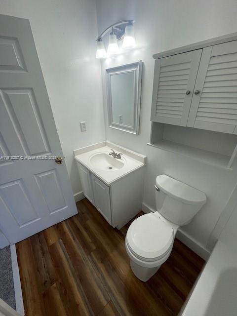 4938 Palmbrooke Circle West Palm Beach, FL 33417 - Photo 20 of 32 a bathroom with a toilet a sink and mirror