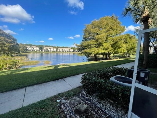 4938 Palmbrooke Circle West Palm Beach, FL 33417 - Photo 29 of 32 a view of a garden with a building in the background