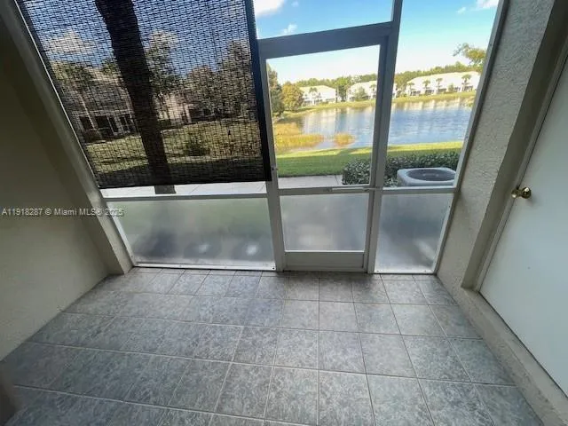 a view of a patio with table and chairs and potted plants