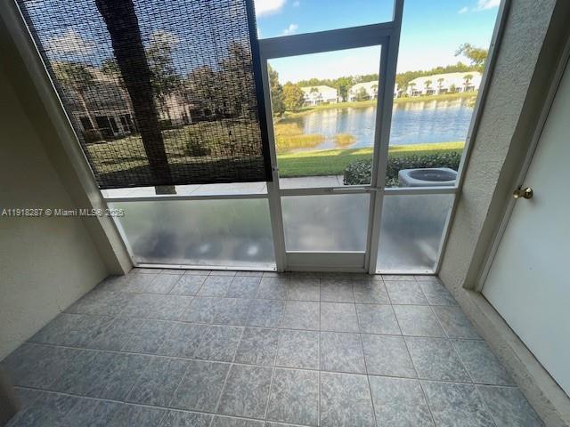 4938 Palmbrooke Circle West Palm Beach, FL 33417 - Photo 30 of 32 a view of a kitchen with an empty space and a window