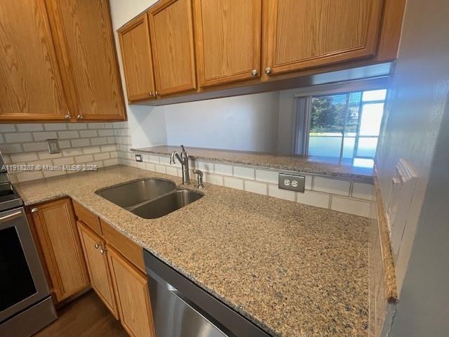 4938 Palmbrooke Circle West Palm Beach, FL 33417 - Photo 6 of 32 a kitchen with sink cabinets and window