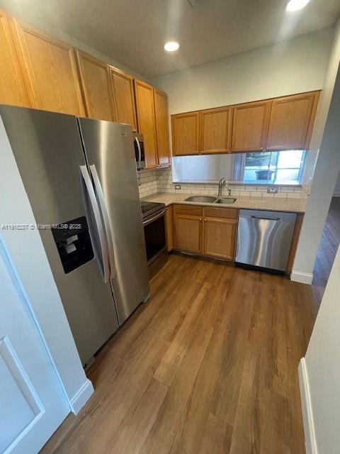 4938 Palmbrooke Circle West Palm Beach, FL 33417 - Photo 8 of 32 a kitchen with stainless steel appliances a refrigerator a sink and a stove