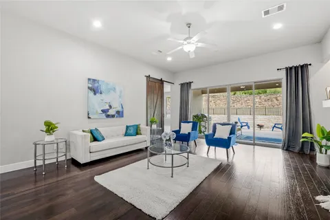 a dining room with furniture and a potted plant