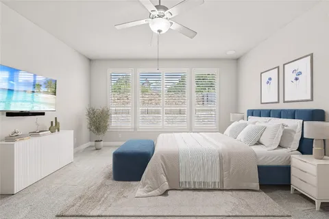 a bedroom with a large bed and a chandelier