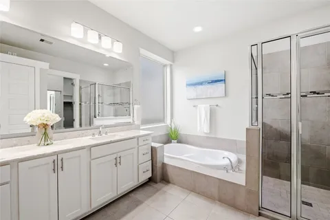 a bedroom with a large bed and a couch