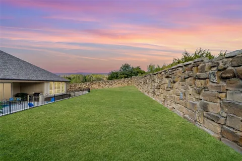 a view of a garden with a building in the back