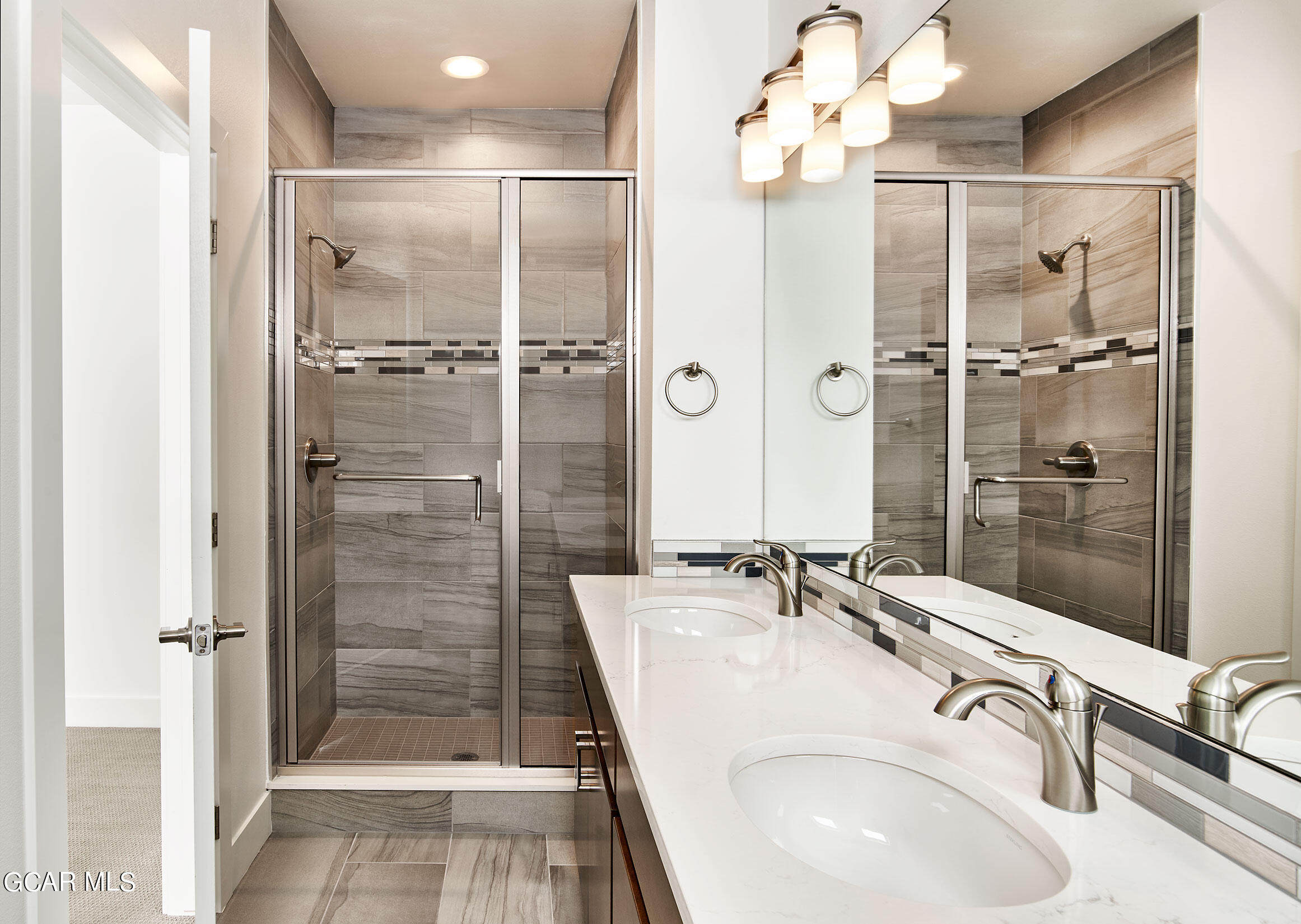 156 Homestead Loop Fraser, CO 80442 - Photo 12 of 16 a bathroom with a sink shower and a mirror