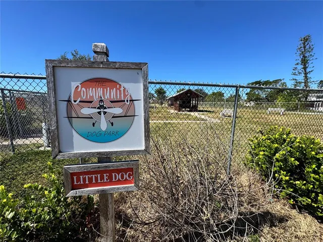 a view of a brick wall with an outdoor space
