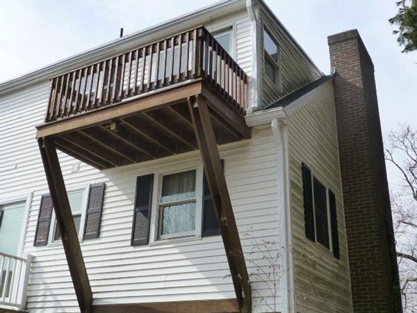 57 Florence Road Easthampton, MA 01027 - Photo 17 of 29 a view of a balcony with wooden floor and stairs