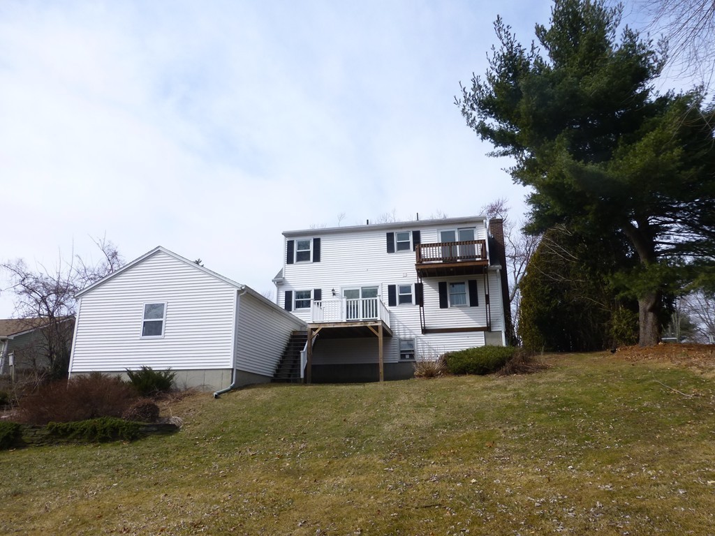 57 Florence Road Easthampton, MA 01027 - Photo 2 of 29 a front view of a house with a yard and garage