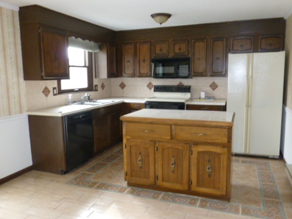 57 Florence Road Easthampton, MA 01027 - Photo 9 of 29 a kitchen with a sink stove and refrigerator