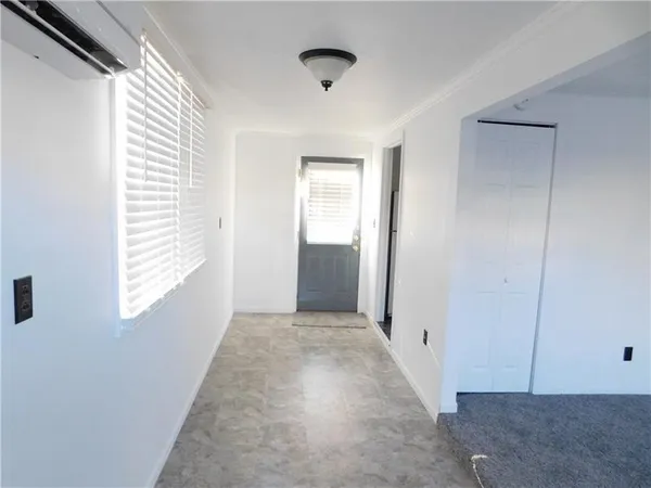 a view of hallway with windows