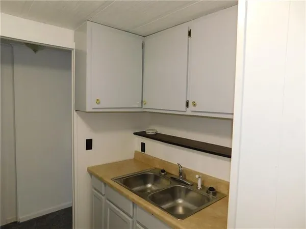 a utility room with sink dryer and washer