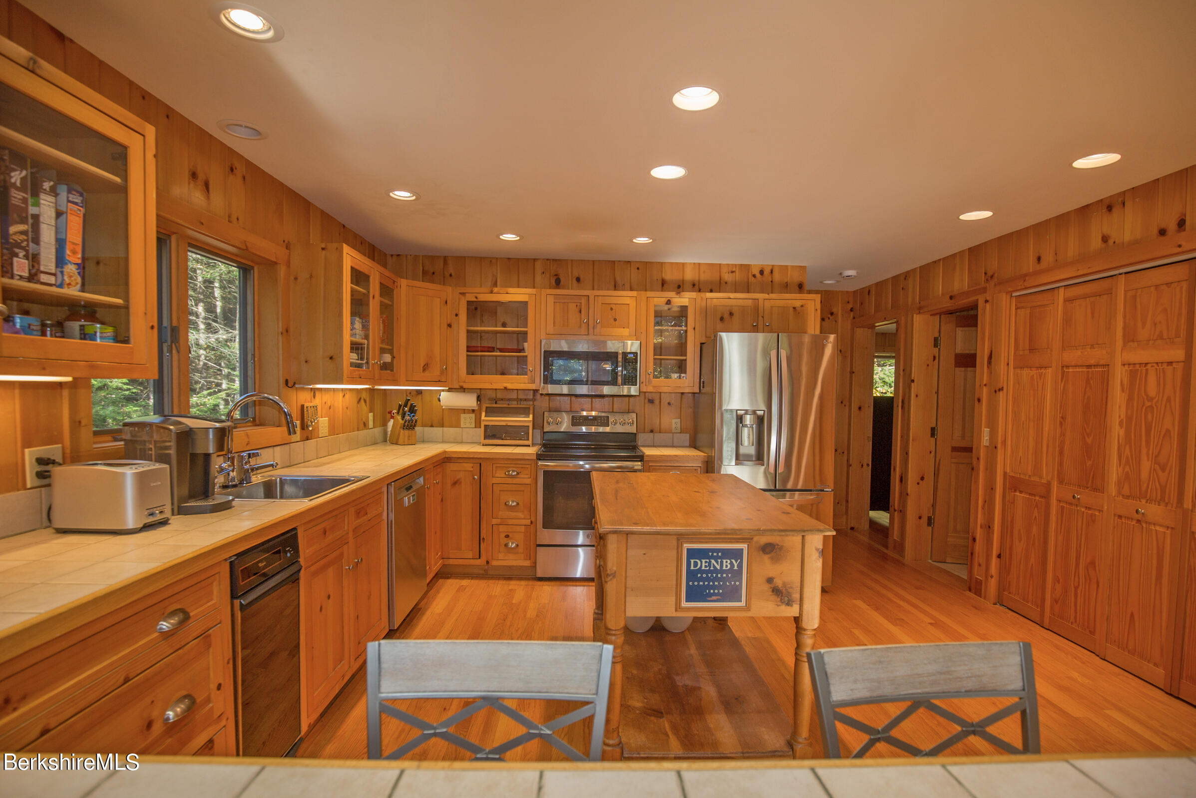 526 Bonny Rigg Hill Road Becket, MA 01223 - Photo 7 of 43 a large kitchen with stainless steel appliances kitchen island granite countertop a refrigerator and a stove top oven