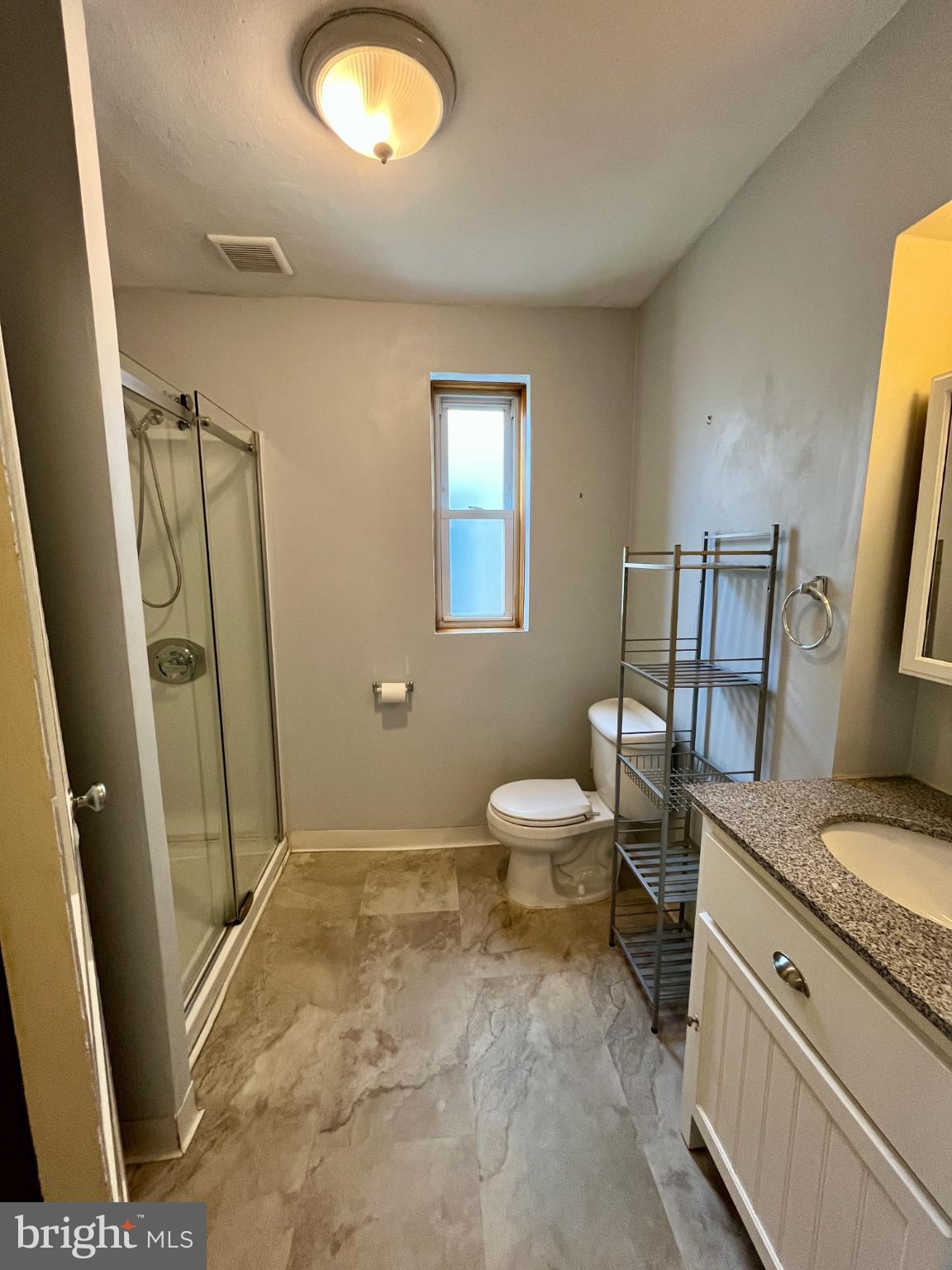 1217 Wharton Street Philadelphia, PA 19147 - Photo 20 of 27 a bathroom with a granite countertop sink toilet and shower
