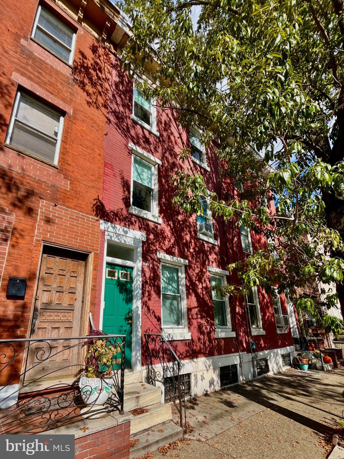 1217 Wharton Street Philadelphia, PA 19147 - Photo 2 of 27 front view of a building with a tree