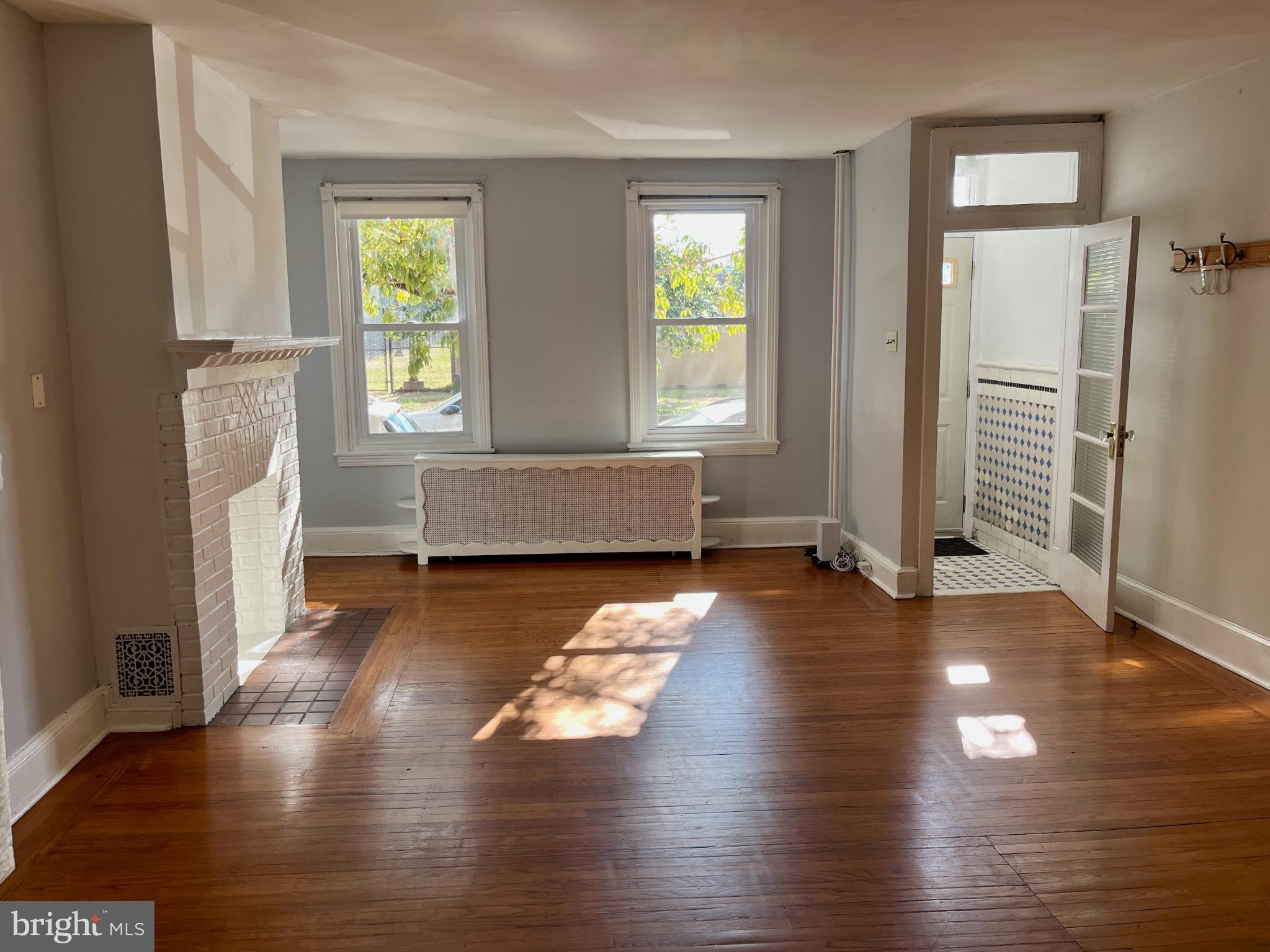 1217 Wharton Street Philadelphia, PA 19147 - Photo 5 of 27 a living room with hard wood floors and a window