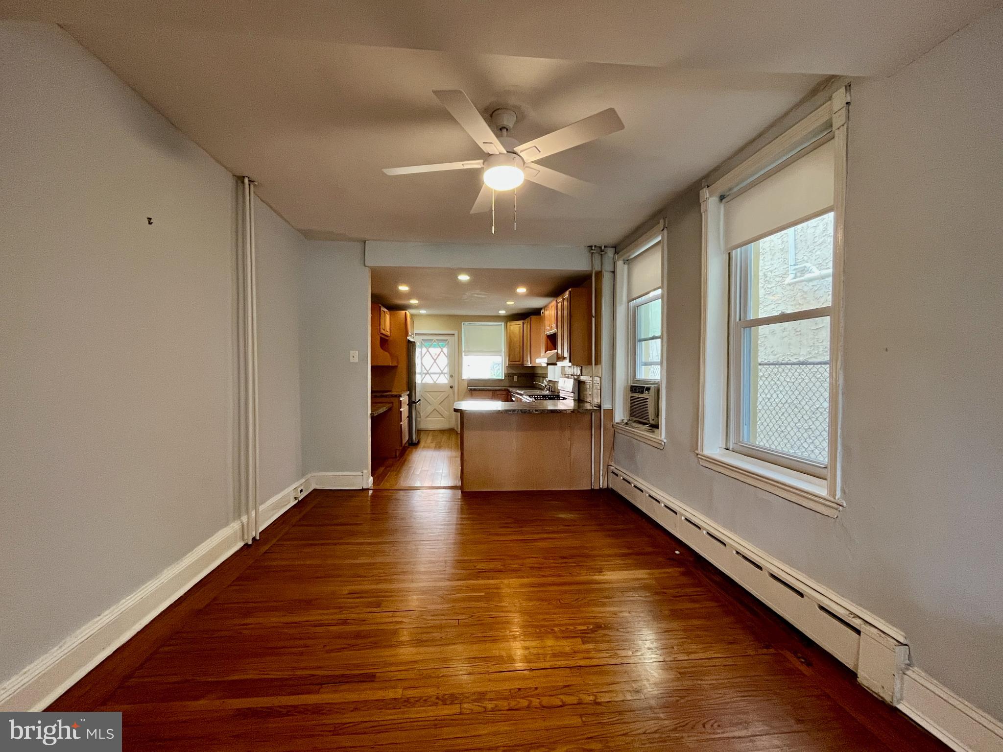 1217 Wharton Street Philadelphia, PA 19147 - Photo 7 of 27 a view of an empty room with window and wooden floor