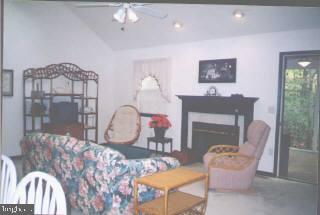102 Sandyhook Road Ocean Pines, MD 21811 - Photo 3 of 5 a living room with furniture and a fireplace