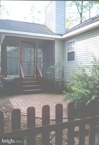 102 Sandyhook Road Ocean Pines, MD 21811 - Photo 5 of 5 a front view of a house with a yard