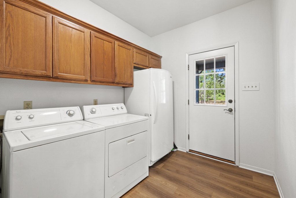 244 Woodway Elgin, TX 78621 - Photo 17 of 40 a utility room with dryer and washer