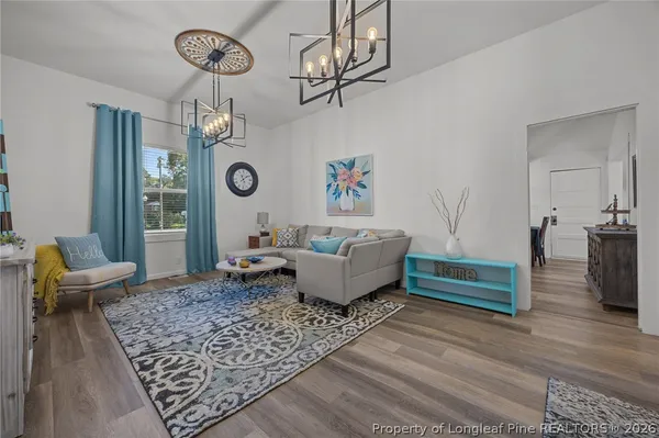 a living room with furniture and a rug