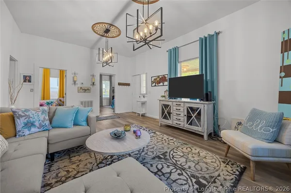 a living room with furniture and a rug