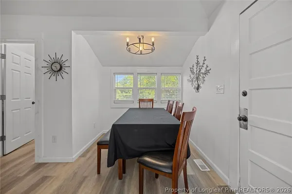 a kitchen with stainless steel appliances granite countertop a stove and a microwave