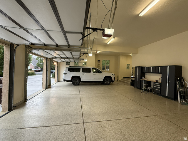 650 East Center Street Alpine, UT 84004 - Photo 36 of 38 Spacious garage with epoxy-coated flooring, and overhead fluorescent lighting