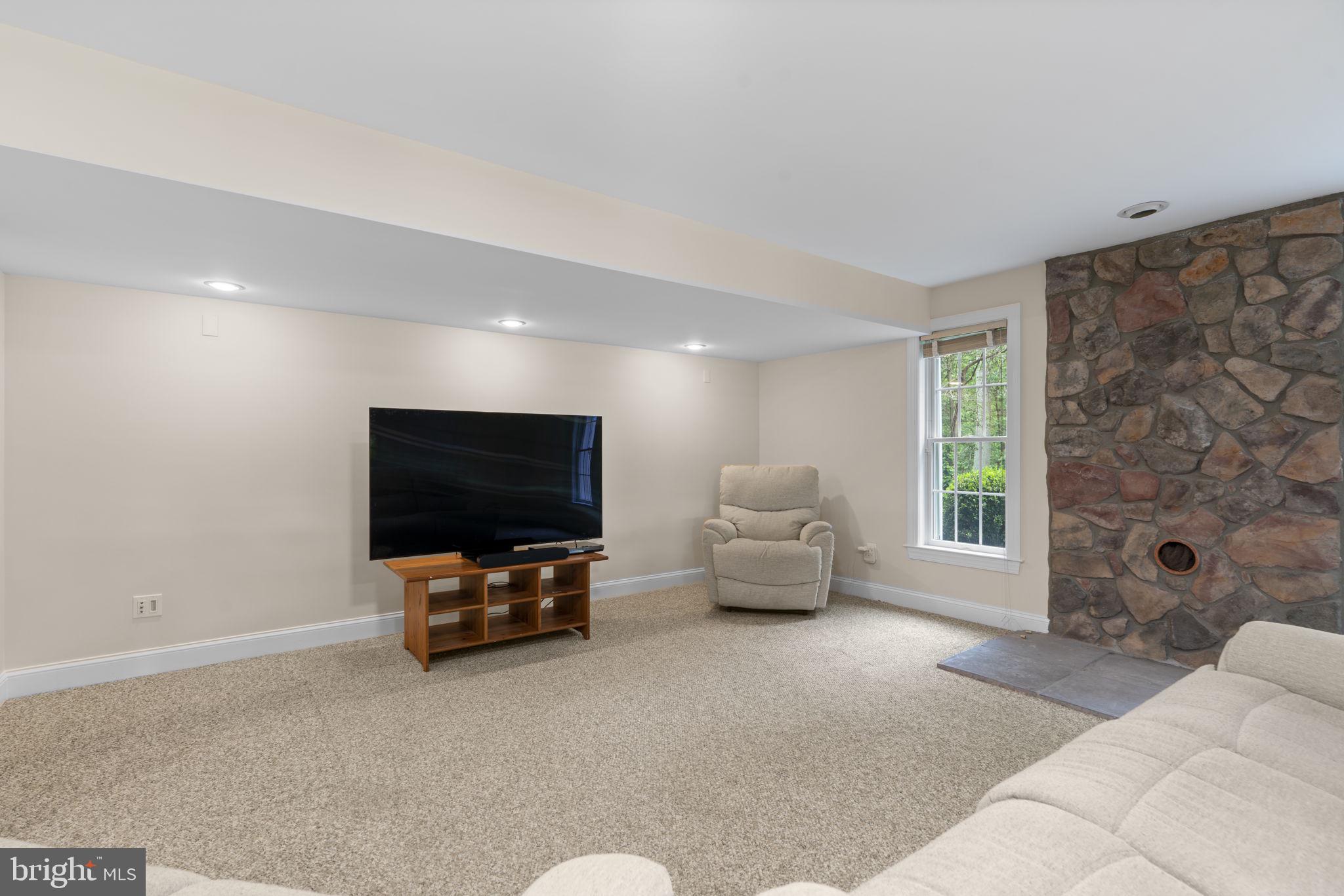 798 Creek View Road Severna Park, MD 21146 - Photo 49 of 72 a living room with furniture and a flat screen tv