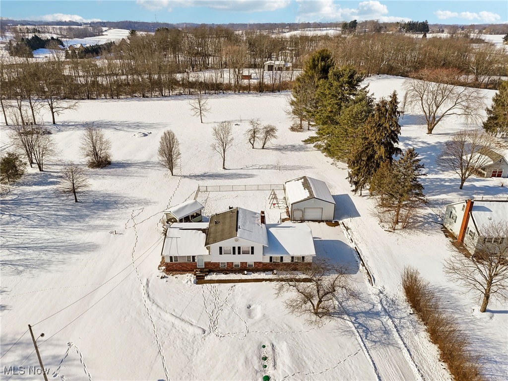 1247 Griggy Road Mogadore, OH 44260 - Photo 3 of 42 Drone view of the property. Large pine in right corner is approx property line
