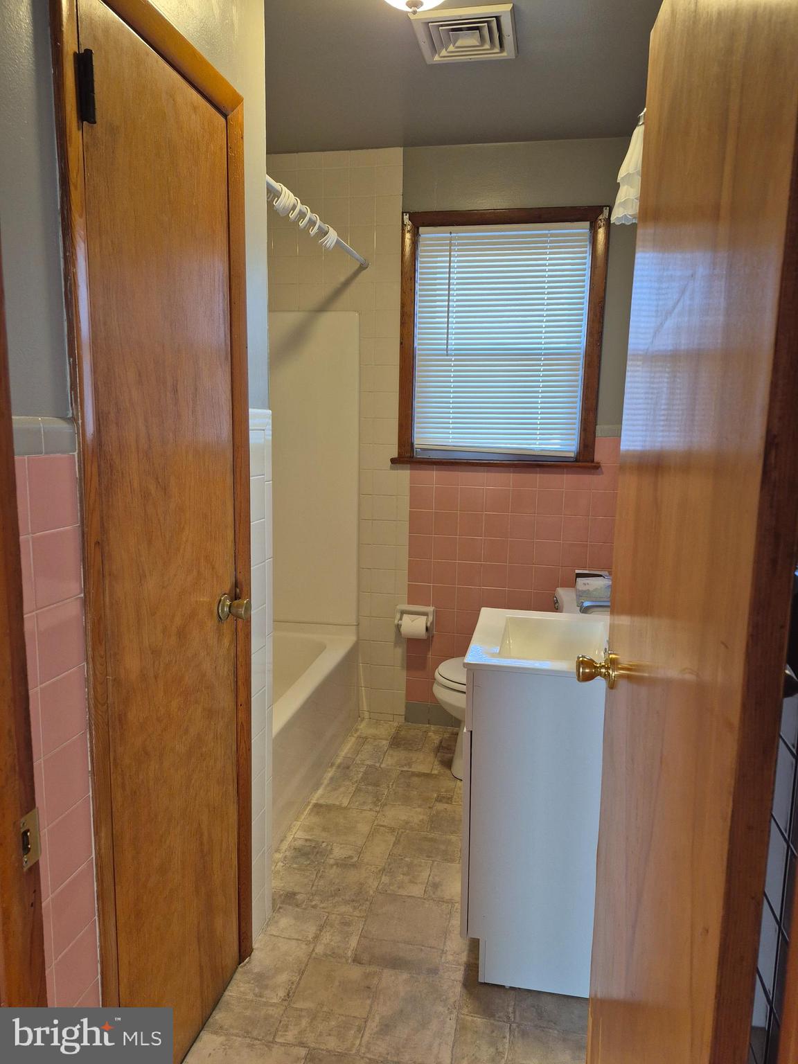 4866 Trento Avenue Vineland, NJ 08361 - Photo 12 of 15 a bathroom with a sink and mirror
