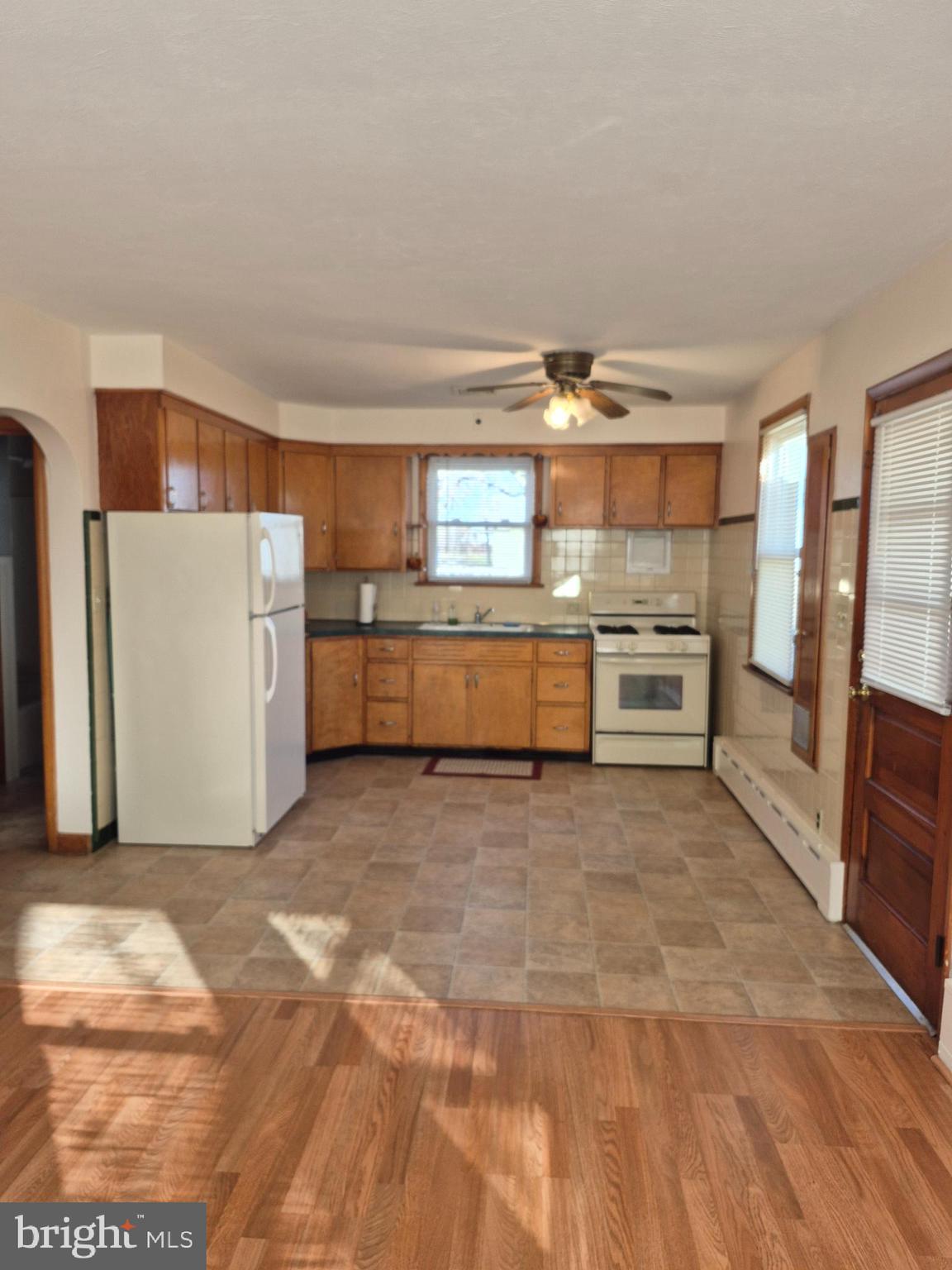 4866 Trento Avenue Vineland, NJ 08361 - Photo 5 of 15 a room with stainless steel appliances a stove a refrigerator and a cabinets