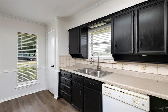 a kitchen with a sink and a window