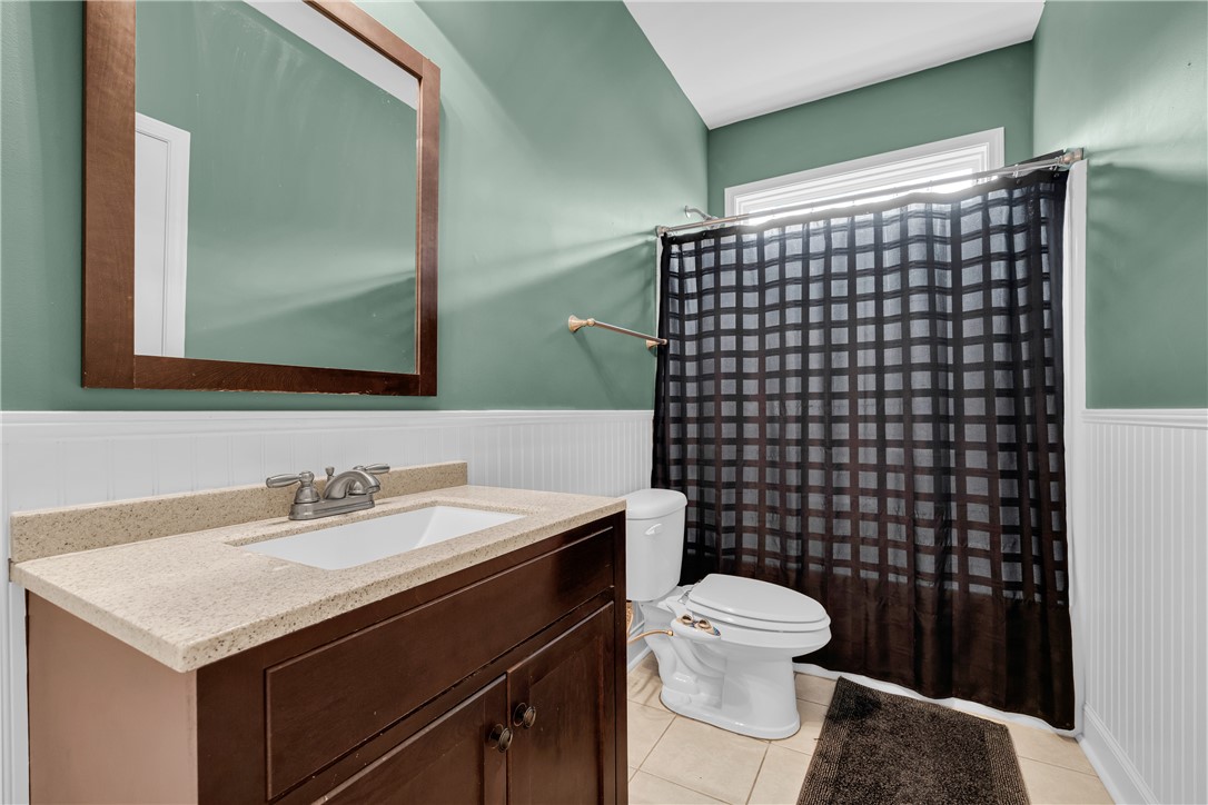 5 Drakeford Court Anderson, SC 29621 - Photo 26 of 46 High ceilings and wainscoting paneling elevate the design of this fully equipped bathroom.