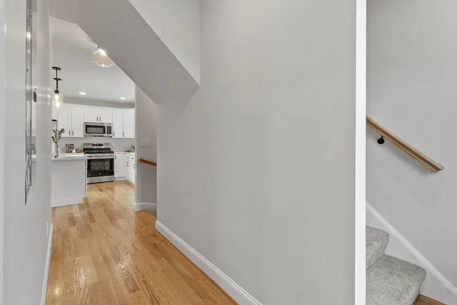 a view of kitchen with wooden floor