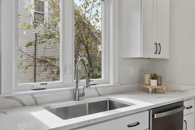 a kitchen with a sink and a window