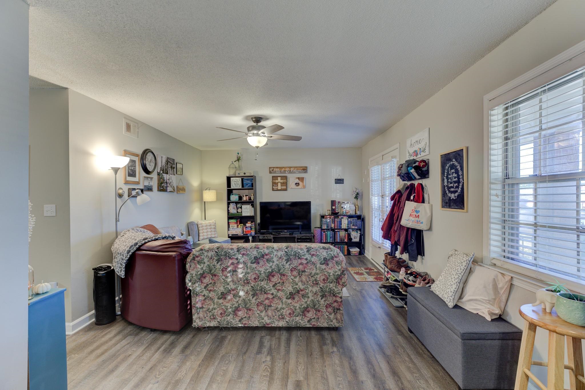 5696 Quince Road, Unit 7 Memphis, TN 38119 - Photo 5 of 22 a living room with furniture and a flat screen tv