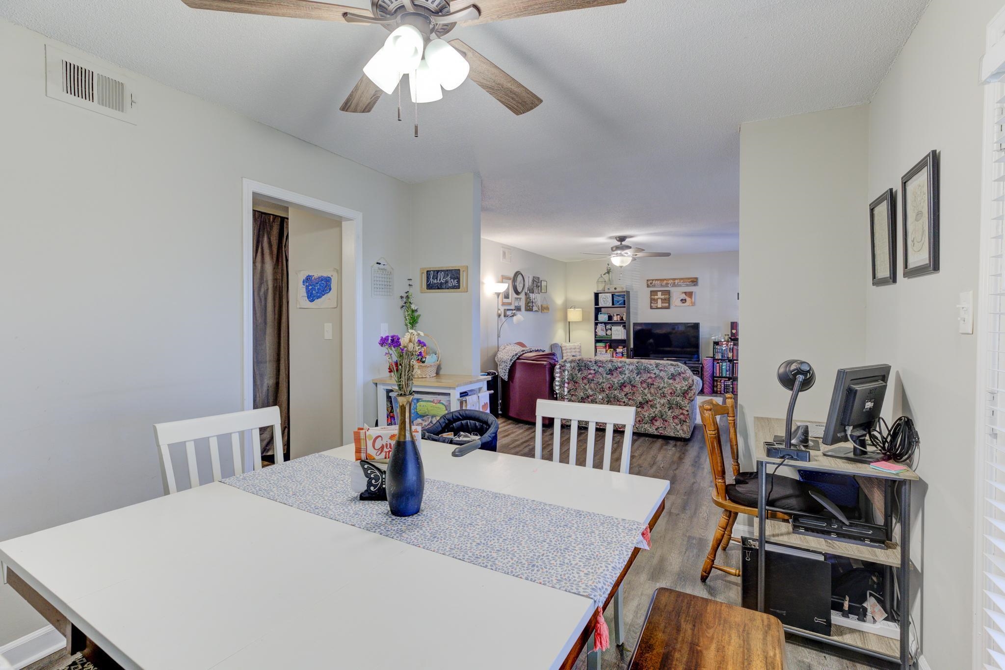 5696 Quince Road, Unit 7 Memphis, TN 38119 - Photo 9 of 22 a dining room with furniture and wooden floor
