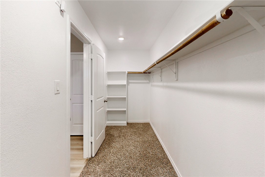 2010 Chief Street Bryan, TX 77807 - Photo 26 of 29 a view of walk in closet with empty racks