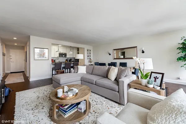 a bedroom with a bed couch and window