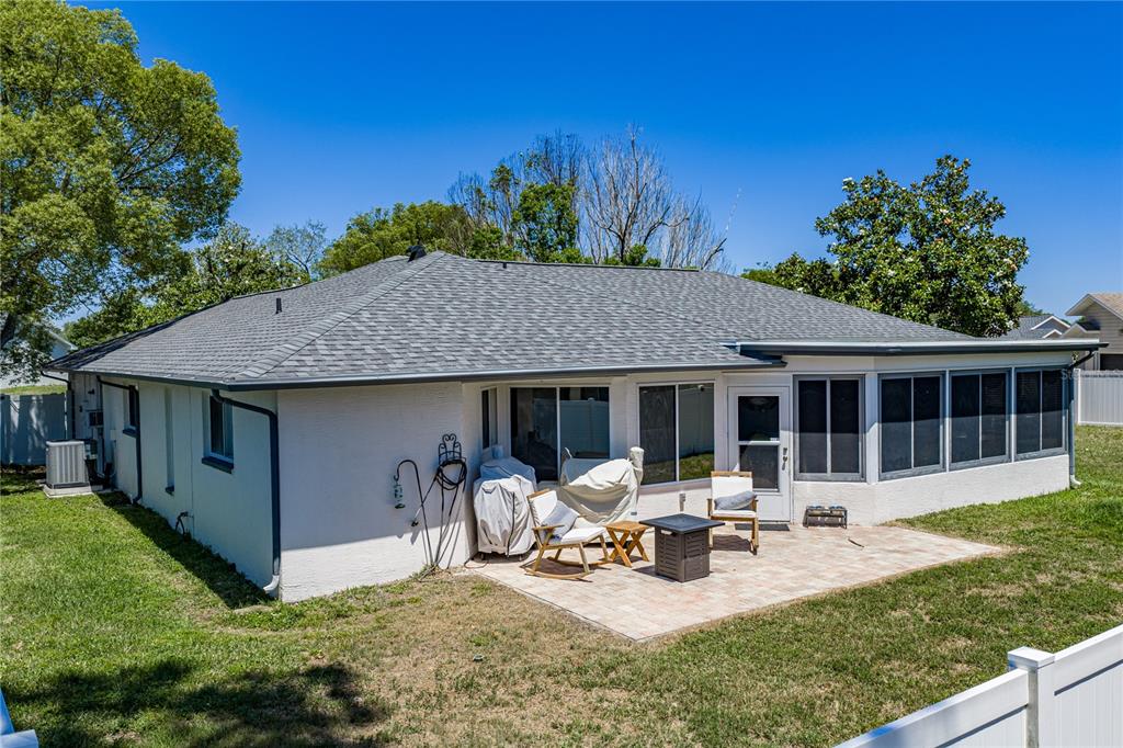 7435 Kilbride Court Weeki Wachee, FL 34613 - Photo 47 of 67 a view of a house with backyard porch and sitting area